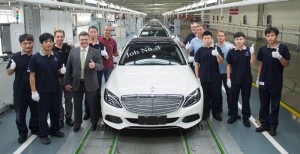 Frank Deiss (fourth from left), President and CEO Beijing Benz Automotive (BBAC), with team-members at the production line, celebrating the first Mercedes-Benz Long-wheelbase C-Class in Beijing.