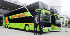 Heinz Friedrich, Setra brand spokesman for Germany, officially hands over two of a total of three new double-decker buses to Managing Director Philipp Hörmann