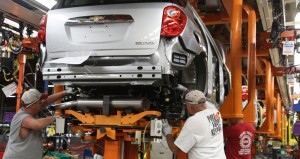 Robert Honaker (l to r), William Stewart and Doug Cain assemble a Chevrolet Equinox Wednesday, August 27, 2014 on the assembly line at the General Motors Spring Hill manufacturing complex in Spring Hill, Tennessee. GM said today it will invest $185 million to make small gas engines at the complex, retaining 390 jobs. GM also announced the next-generation Cadillac SRX mid-size vehicle will be produced at Spring Hill. (Photo by Alan Poizner for General Motors)