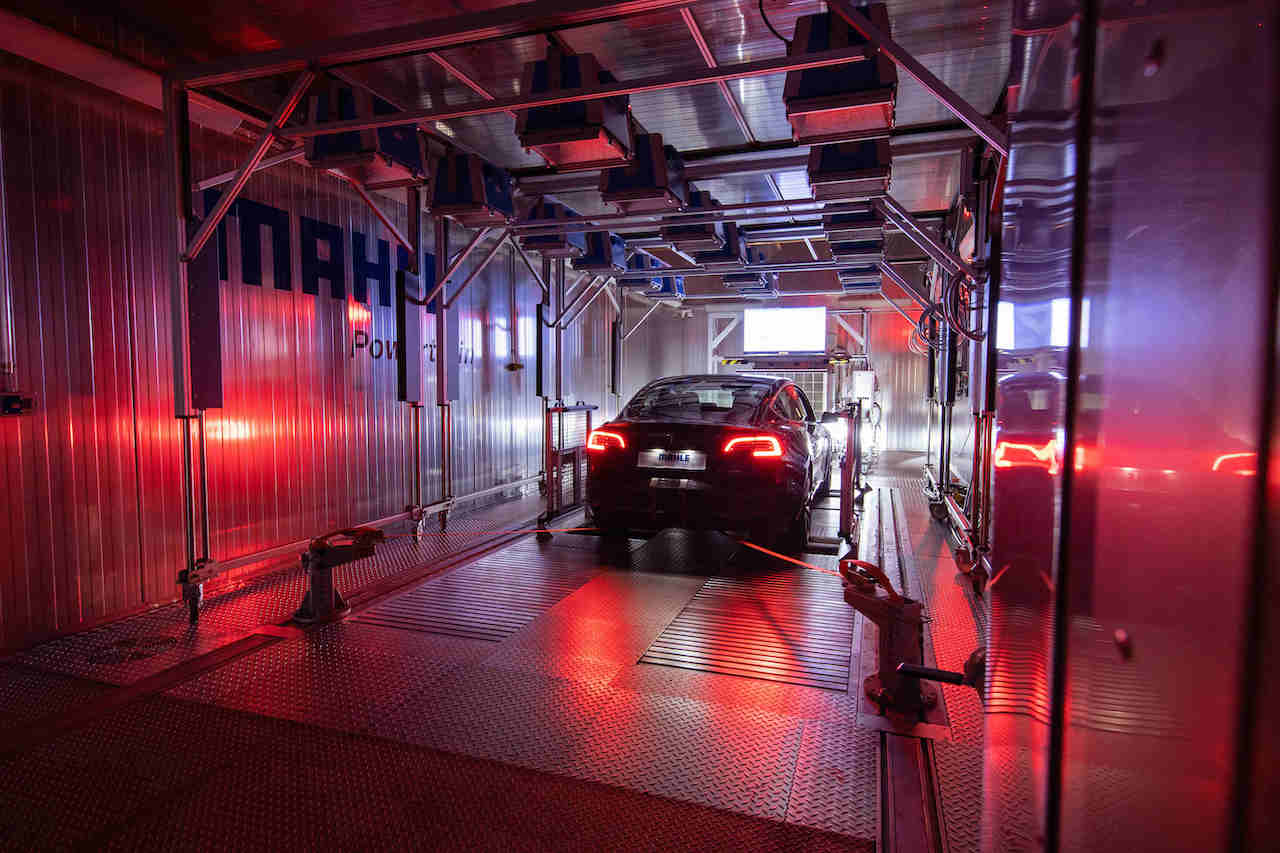 A car in a chamber with metal-lined walls